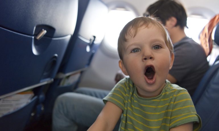 a person who figured out how to fly with toddlers