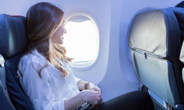 Flight Attendant Sitting In A Jump Seat With A Telephone High-Res Stock  Photo - Getty Images