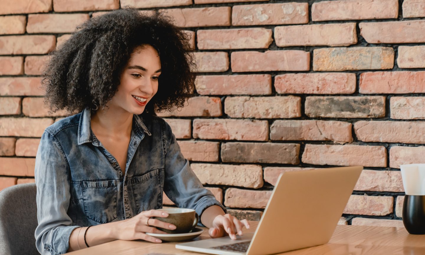 Woman sitting at desk and back straight hi-res stock photography