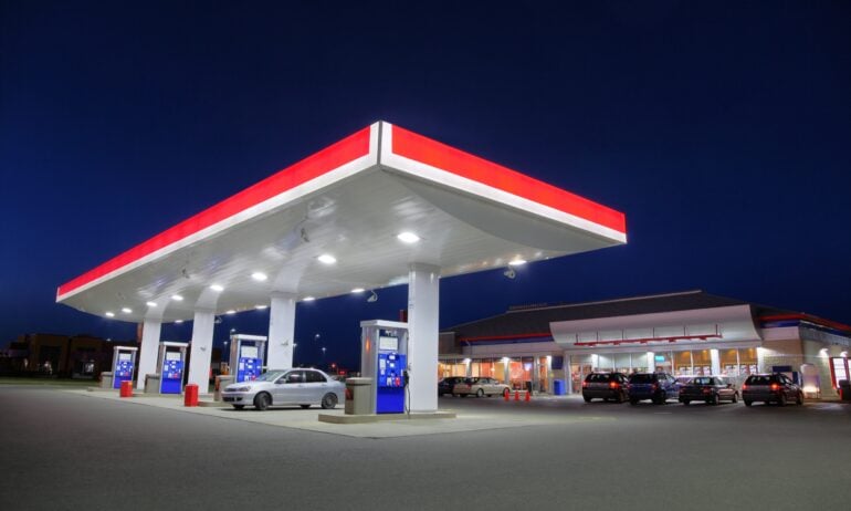 Car Refueling at Gas Station during the Night