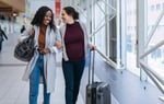 Women traveling together in an airport.