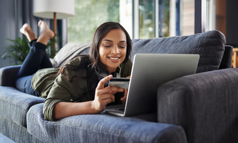 Woman shops online with a credit card