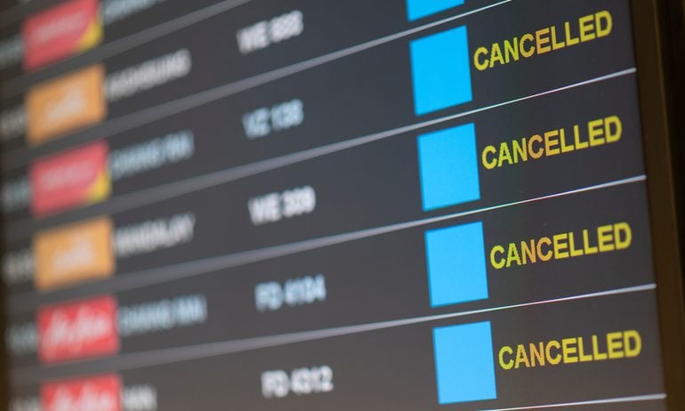 Departure flight board with cancelation at the Airport.