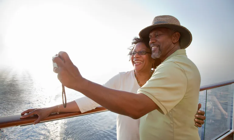 Mature African American couple posing for self portrait while on deck of a cruise ship